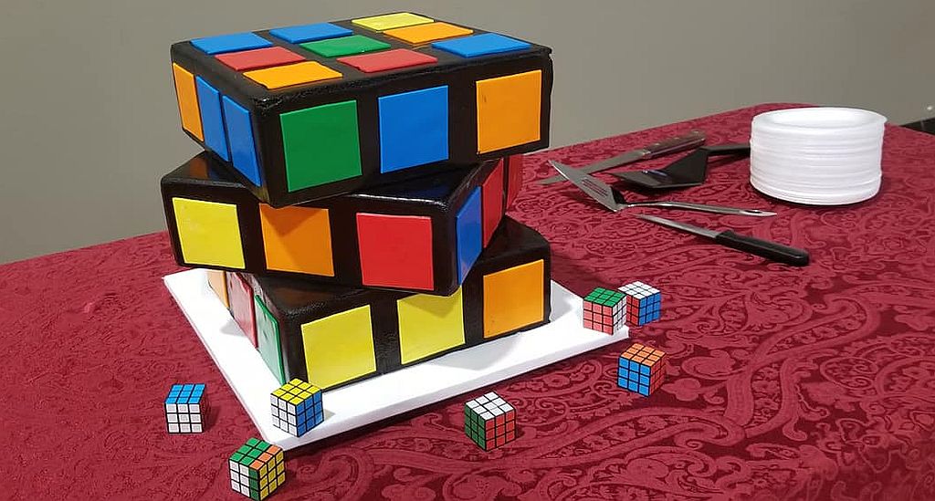 a cake shaped like a twisted Rubik cube