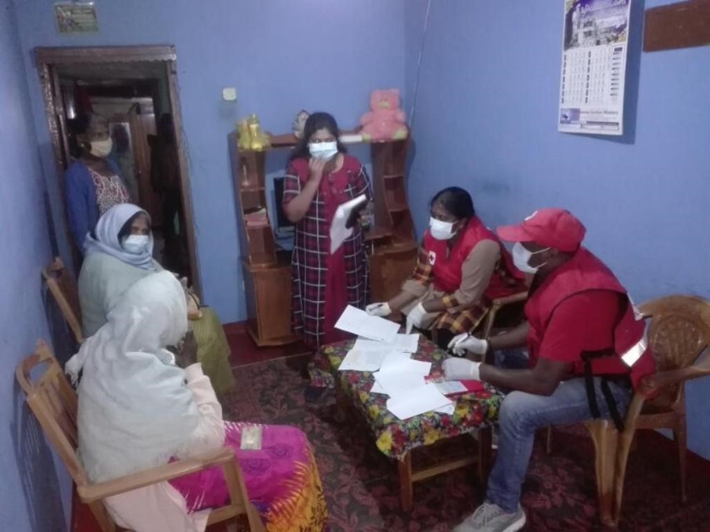 Deaf Link staff preparing name lists of beneficiaries